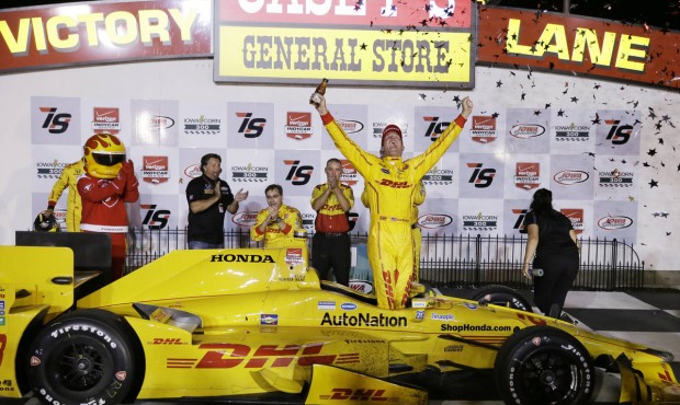 Ryan Hunter-Reay celebrates in Victory Lane after winning the IndyCar Series auto race Saturday, Ju...