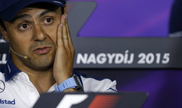 Williams driver Felipe Massa of Brazil speaks and gestures during a press conference before the Hun...