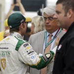 
              Ed Carpenter, left, talks with Mark Miles, CEO of IndyCar, in the garage area during a delay in qualifications for the Indianapolis 500 auto race at Indianapolis Motor Speedway in Indianapolis, Sunday, May 17, 2015. Carpenter crashed during practice in the morning, forcing a change to the cars for qualifications.  (AP Photo/Darron Cummings)
            