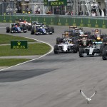 
              Mercedes driver Lewis Hamilton (44), right, of Great Britain leads the pack into the Senna corner as they start the Canadian Grand Prix auto race on Sunday, June 7, 2015, in Montreal. (Ryan Remiorz/The Canadian Press via AP) MANDATORY CREDIT
            