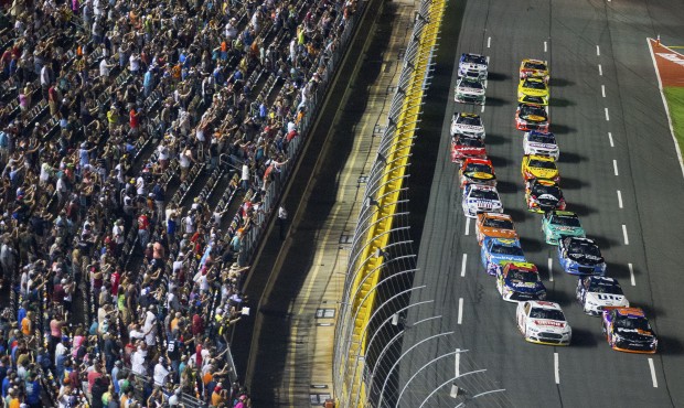 Drivers make their way down the front stretch to start the NASCAR Sprint All-Star auto race at Char...
