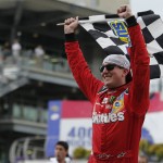 
              Kyle Busch celebrates after winning the NASCAR Brickyard 400 auto race at Indianapolis Motor Speedway in Indianapolis, Sunday, July 26, 2015. (AP Photo/AJ Mast)
            