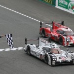 
              The Porsche 919 Hybrid No19 of the Porsche Team driven by Nico Hulkenberg of Germany, Earl Bamber of New Zealand and Nick Tandy of Great Britain crosses the finish line to win the 83rd 24-hour Le Mans endurance race ahead of the Porsche 919 Hybrid No17 driven by Timo Bernhard of Germany, Marck Webber of Australia and Brendon Hartley of New Zealand, in Le Mans, western France, Sunday, June 14, 2015. (AP Photo/David Vincent)
            