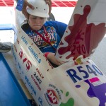 
              Leah Gunnels, of Rickman, Tenn, squeezes into her car before her Rally Masters Division heat in the First Energy All-American Soap Box Derby, in Akron, Ohio, Saturday, July 25, 2015. (AP Photo/Phil Long)
            