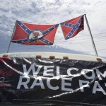 
              Confederate flags fly on top of a motor home at Daytona International Speedway, Saturday, July 4, 2015, in Daytona Beach, Fla. NASCAR and the speedway offered to replace any flag a race brings to the track with an American flag. (AP Photo/Phelan M. Ebenhack)
            