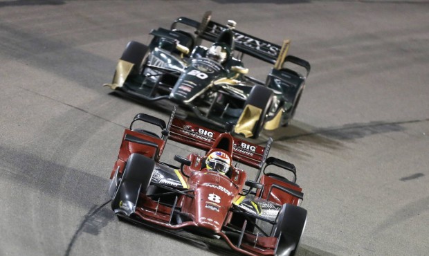 FILE – In this July 18, 2015, file photo, Sage Karam (8) leads Ed Carpenter during an IndyCar...