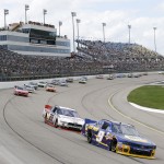 
              Chase Elliott, right, races ahead of Ryan Blaney during the NASCAR Xfinity Series auto race, Sunday, May 17, 2015, at Iowa Speedway in Newton, Iowa. (AP Photo/Charlie Neibergall)
            