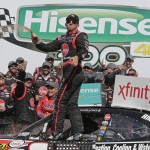 
              Austin Dillon celebrates in Victory Lane after winning the NASCAR Xfinity series auto race at Charlotte Motor Speedway in Concord, N.C., Saturday, May 23, 2015. (AP Photo/Chuck Burton)
            
