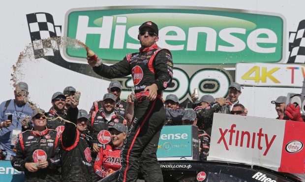 Austin Dillon celebrates in Victory Lane after winning the NASCAR Xfinity series auto race at Charl...