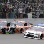 
              Kasey Kahne (5) leads Carl Edwards (19) and Kevin Harvick (4) during the NASCAR Sprint Cup series auto race at Michigan International Speedway, Sunday, June 14, 2015, in Brooklyn, Mich. (AP Photo/Carlos Osorio)
            