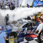 
              Jimmie Johnson pulls into Victory Lane after he won the NASCAR Sprint Cup series auto race, Sunday, May 31, 2015, at Dover International Speedway in Dover, Del. (AP Photo/Nick Wass)
            