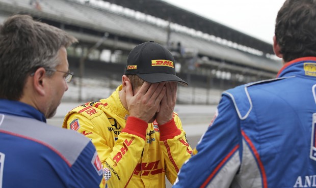 Ryan Hunter-Reay reacts after watching the wreck of James Hinchcliffe, of Canada, during practice f...