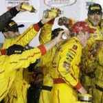 
              Ryan Hunter-Reay celebrates with crew members in Victory Lane after winning the IndyCar Series auto race Saturday, July 18, 2015, at Iowa Speedway in Newton, Iowa. (AP Photo/Charlie Neibergall)
            
