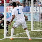
              Guatemala goalkeeper Paulo Motta, left, reaches for an own goal by Carlos Castrillo, not seen, as defender Ruben Morales (2) watches during the first half of an international friendly soccer match against the United States on Friday, July 3, 2015, in Nashville, Tenn. (AP Photo/Mark Humphrey)
            