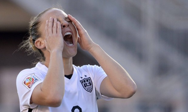 United States’ Amy Rodriguez reacts after missing on a shot against China during the first ha...