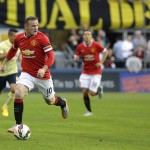 
              Manchester United's Wayne Rooney, left, looks to pass against Club America during the first half of an international friendly soccer match, Friday, July 17, 2015, in Seattle. (AP Photo/Ted S. Warren)
            