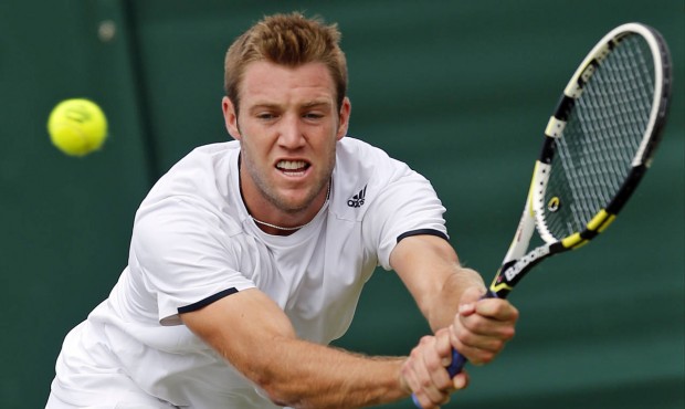FILE – In this June 26, 2014, file photo, Jack Sock, of the United States, returns a shot to ...
