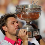 
              Switzerland's Stan Wawrinka lifts the cup after defeating Serbia's Novak Djokovic in their final match of the French Open tennis tournament at the Roland Garros stadium, Sunday, June 7, 2015 in Paris. Wawrinka won 4-6, 6-4, 6-3, 6-4. (AP Photo/Christophe Ena)
            