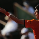 
              Serbia's Novak Djokovic serves the ball to Britain's Andy Murray during their semifinal match of the French Open tennis tournament at the Roland Garros stadium, Friday, June 5, 2015 in Paris, France. (AP Photo/Christophe Ena)
            