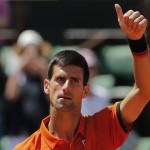 
              Serbia's Novak Djokovic thumbs up after defeating Britain's Andy Murray during their semifinal match of the French Open tennis tournament at the Roland Garros stadium, Saturday, June 6, 2015 in Paris.  (AP Photo/Christophe Ena)
            