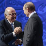 
              FIFA President Sepp Blatter, left, shakes hand with Russian President Vladimir Putin during the preliminary draw for the 2018 soccer World Cup in Konstantin Palace in St. Petersburg, Russia, Saturday, July 25, 2015. (AP Photo/Ivan Sekretarev
            
