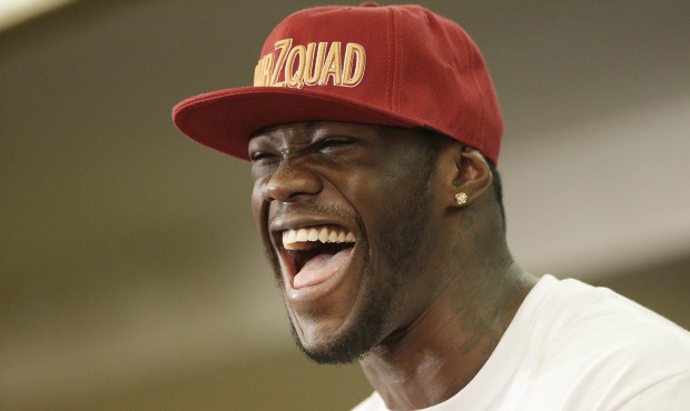 WBC heavyweight boxing champion Deontay Wilder laughs during a news conference Thursday, June 11, 2...