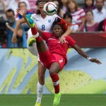 
              England's Jill Scott, left, and Canada's Kadeisha Buchanan vie for the ball during first-half FIFA Women's World Cup quarterfinal soccer game action in Vancouver, British Columbia, Canada, on Saturday, June 27, 2015. (Darryl Dyck/The Canadian Press via AP) MANDATORY CREDIT
            