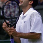 
              FILE - In this Sunday, July 9, 2000 file photo, Pete Sampras reacts after winning a point in the fourth set against Australia's Patrick Rafter in the Men's Singles final on the Centre Court at the All England Lawn Tennis Championships in Wimbledon, London. Pistol Pete dominated the 1990s at Wimbledon, his serving prowess and searing forehand driving him to seven Wimbledon victories out of eight. His final victory in 2000 against Rafter took his Grand Slam haul to a then-record 13. (AP Photo/Dave Caulkin, File)
            