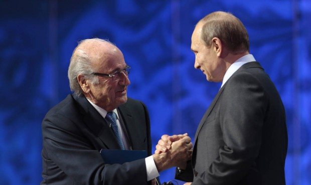 FIFA President Sepp Blatter, left, shakes hand with Russian President Vladimir Putin during the pre...