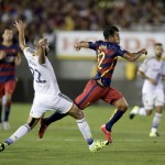 
              FC Barcelona's Rafinha, right, is tackled by Los Angeles Galaxy's Leonardo during the first half of an International Champions Cup soccer match Tuesday, July 21, 2015, in Pasadena, Calif. (AP Photo/Jae C. Hong)
            
