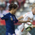 
              Japan's Azusa Iwashimizu fights for control of the ball with Netherlands' Vivianne Miedema during the first half of a round of 16 soccer match at the FIFA Women's World Cup, Tuesday, June 23, 2015, in Vancouver, British Columbia, Canada. (Jonathan Hayward/The Canadian Press via AP)
            