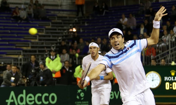 Carlos Berlocq, of Argentina, returns the ball during a Davis Cup doubles quarter finals tennis mat...