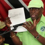 
              Former FIFA vice president Jack Warner hold a copy of a check while he speaks at a political rally in Marabella, Trinidad and Tobago, Wednesday, June 3, 2015. Warner made a televised address Wednesday night, saying he will prove a link between soccer's governing body and his nation's elections in 2010. Warner said he has documents and checks that link FIFA officials, including embattled President Sepp Blatter, to the 2010 election in Trinidad and Tobago. (AP Photo/Anthony Harris)
            
