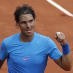 
              Spain's Rafael Nadal clenches his fist after defeating compatriot Nicolas Almagro during their second round match of the French Open tennis tournament at the Roland Garros stadium, Thursday, May 28, 2015 in Paris,  (AP Photo/Christophe Ena)
            