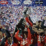 
              Chile's players hold up the trophy after the Copa America final soccer match against Argentina at the National Stadium in Santiago, Chile, Saturday, July 4, 2015. Bravo made a save and striker Alexis Sanchez converted the winning penalty as host Chile defeated Argentina 4-1 in a shootout after a 0-0 draw in the Copa America final on Saturday, finally winning its first major title.(AP Photo/Natacha Pisarenko)
            