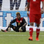 
              Cuba goalkeeper Disovelis Guerra sits on the field after United States' Gyasi Zardes scored a goal during the first half of a CONCACAF Gold Cup soccer quarterfinal match, Saturday, July 18, 2015, in Baltimore. (AP Photo/Patrick Semansky)
            