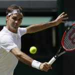 
              Roger Federer of Switzerland plays a return to Sam Groth of Australia during their singles match at the All England Lawn Tennis Championships in Wimbledon, London, Saturday July 4, 2015. (AP Photo/Tim Ireland)
            