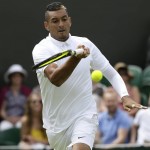 
              Nick Kyrgios of Australia returns a ball to Diego Schwartzman of Argentina during the men's singles first round match at the All England Lawn Tennis Championships in Wimbledon, London, Monday June 29, 2015. (AP Photo/Tim Ireland)
            