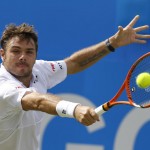 
              Switzerland's Stan Wawrinka returns a shot to South Africa's Kevin Anderson, during their men's singles tennis match of  the Queen's tennis championship, in London, Wednesday, June 17, 2015. (AP Photo/Kirsty Wigglesworth)
            