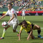 
              United States' Lauren Holiday (12) and Colombia's Orianica Velasquez (9) watch the ball during first half FIFA Women's World Cup round of 16 soccer action in Edmonton, Alberta, Canada, Monday, June 22, 2015.  (Jason Franson/The Canadian Press via AP) MANDATORY CREDIT
            