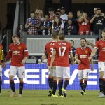 
              Manchester United forward Juan Mata (8) is greeted by his teammates after scoring a goal during the first half of an International Champions Cup soccer match against the San Jose Earthquakes on Tuesday, July 21, 2015, in San Jose, Calif. (AP Photo/Eric Risberg)
            