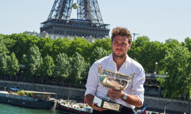 French Open Men’s Singles champion Stan Wawrinka of Switzerland poses for a photo with his tr...