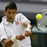 
              Novak Djokovic of Serbia returns a shot to  Marin Cilic of Croatia during their singles match against at the All England Lawn Tennis Championships in Wimbledon, London, Wednesday July 8, 2015. (AP Photo/Kirsty Wigglesworth)
            