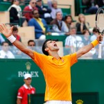 
              FILE - In this April 18, 2015, file photo, Novak Djokovic, of Serbia, celebrates after defeating Rafael Nadal, of Spain, during their semifinal match of the Monte Carlo Tennis Masters tournament in Monaco. When the 2015 French Open begins, Nadal will not be the favorite, despite the way he's ruled Roland Garros. Instead, Novak Djokovic is considered the man to beat. (AP Photo/Claude Paris, File)
            