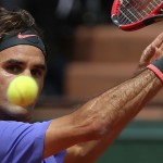 
              Switzerland's Roger Federer eyes the ball as he plays France's Gael Monfils during their fourth round match of the French Open tennis tournament at the Roland Garros stadium, Monday, June 1, 2015 in Paris. Federer won 6-3, 4-6, 6-4, 6-1. (AP Photo/David Vincent)
            