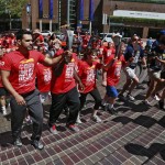 
              In this Friday, July 10, 2015, photo, torch-bearing runners arrive in South Hope Street Plaza to light the Special Olympics cauldron downtown Los Angeles. First lady Michelle Obama will open the Special Olympics World Games on Saturday, July 25, at the Los Angeles Memorial Coliseum, site of both the 1932 and 1984 Summer Olympics. (AP Photo/Nick Ut)
            