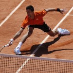 
              Serbia's Novak Djokovic returns the ball to Britain's Andy Murray during their semifinal match of the French Open tennis tournament at the Roland Garros stadium, Saturday, June 6, 2015 in Paris, France. (AP Photo/Francois Mori)
            