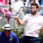 
              France's Gilles Simon returns the ball to Jack Sock from US during their match at the Italian Open tennis tournament, in Rome, Monday, May 11, 2015. (AP Photo/Felice Calabro')
            