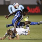 
              Los Angeles Galaxy's Steven Gerrard, bottom, of England, collides with San Jose Earthquakes's Fatai Alashe during the first half of an MLS soccer match, Friday, July 17, 2015, in Carson, Calif. (AP Photo/Jae C. Hong)
            
