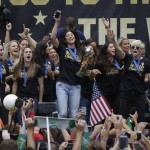 
              Members of the U.S. women's soccer team and fans celebrate the team's World Cup championship during a public celebration, Tuesday, July 7, 2015, in Los Angeles. This was the first U.S. stop for the team since beating Japan in the Women's World Cup final Sunday in Canada. (AP Photo/Jae C. Hong)
            